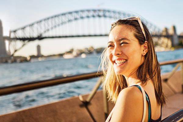 Woman in front of the Sydney Harbour Bridge